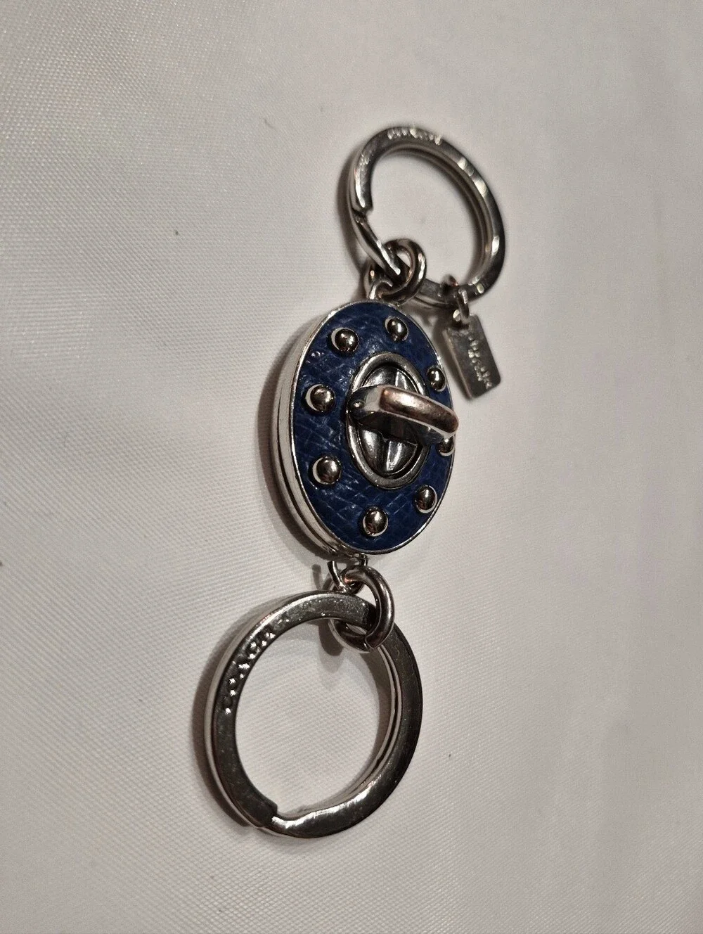 Coach Studded Leather Turnlock Keychain
